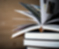 open-book-stack-of-hardback-books-on-wooden-table-2025-01-16-15-13-05-utc.jpg