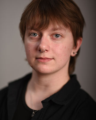 Star Larson is a dancer, choreographer, teaching artist, and movement practitioner based in Western New York. They began dancing at the age of nine at Tiffany Wakeley Academy of Dance in Jamestown, New York, and later earned a BFA in Dance from Slippery Rock University, with a concentration in Studio Ownership and Dance Entrepreneurship. Star has trained in a wide range of forms, including modern, contemporary, ballet, tap, jazz, Bharatanatyam, house, and more. Their movement style is strongly influenced by the release technique of José Limón and continues to evolve through an ongoing exploration of movement, vulnerability, music, and self-expression.
Star is one of the original company members of Sukanya Burman Dance and performed with the company in the inaugural Jamestown Dance Festival production of The Bayadere: The Past, Present, and the Future. They also performed in SBD’s new work We Tried to be Normal, which premiered at Jamestown Pride in 2026. In 2025, Star returned to the festival as a featured regional artist, presenting original choreographic work as part of the Regional Artist Showcase. Through both performance and choreography, Star’s work reflects a deep interest in movement as a raw, honest, and community-centered form of creative expression.