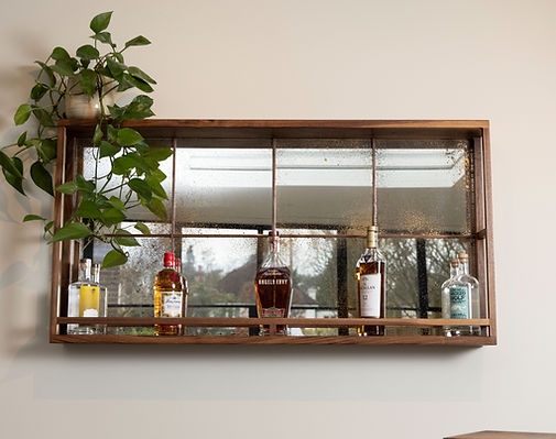 Mirror with drinks caddy