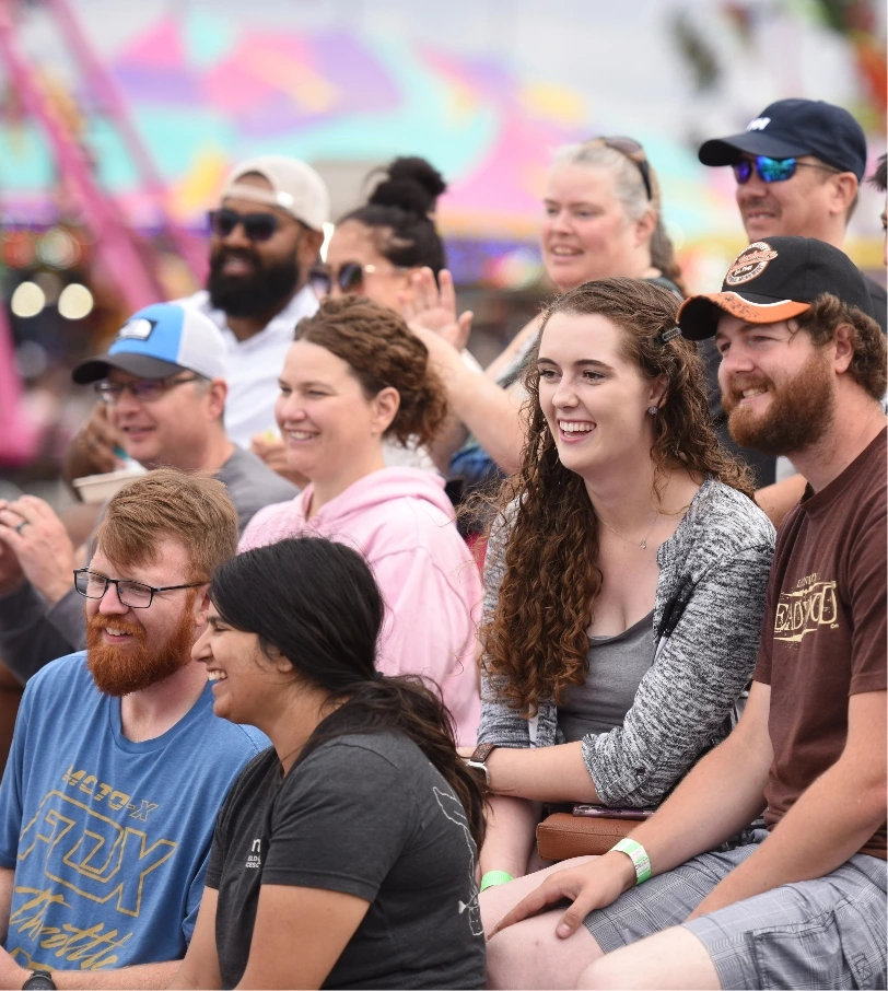 crowd of people smiling and laughing