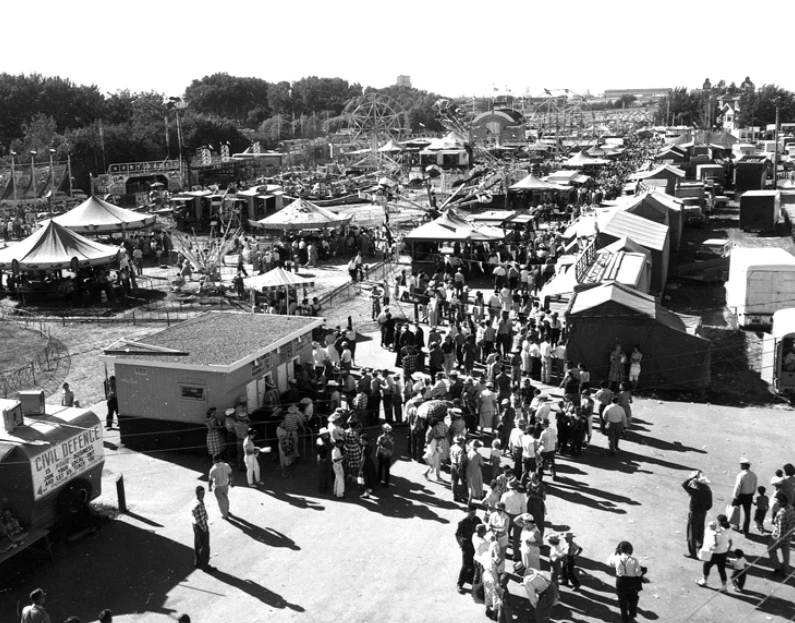 old black and white image of people at fairgrouind at Lethbridge and district exhibition grounds