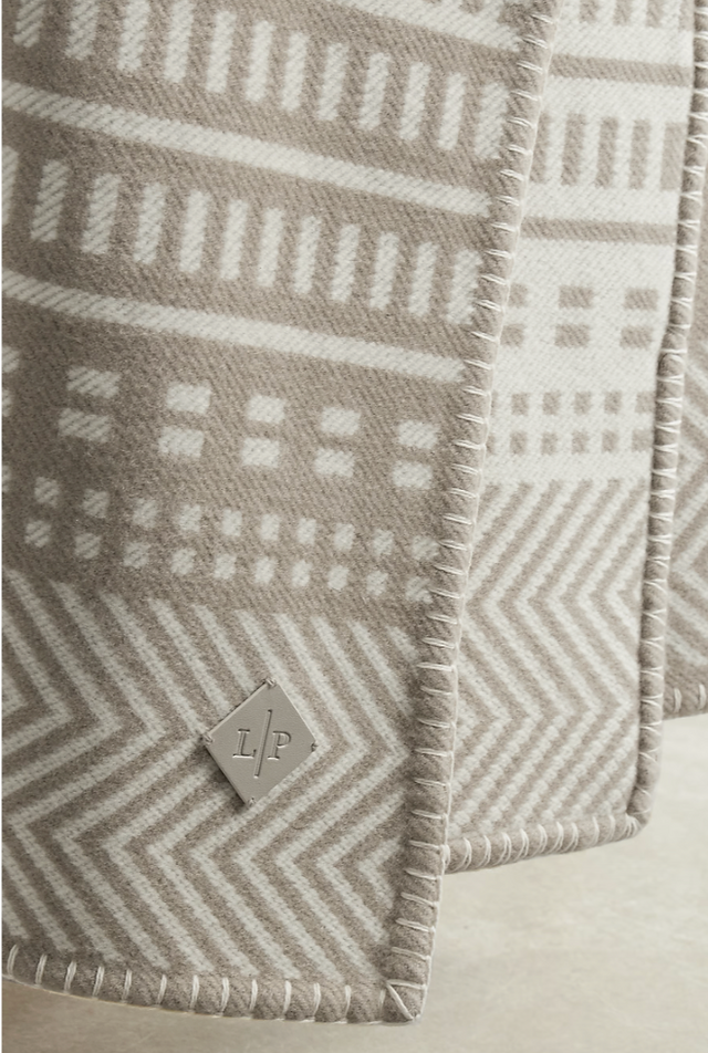 white and grey cashmere blanket with blanket-stitch finishing