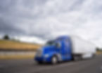Classic dark blue big rig American popular bonnet semi truck with dry van semi trailer goi