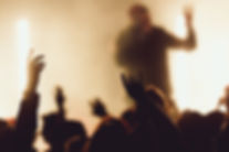 dancing-concert-while-singer-is-performing-surrounded-with-lights.jpg
