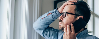 frustrated-businessman-using-phone.png