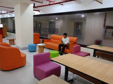 Students relaxing in social lounge space
