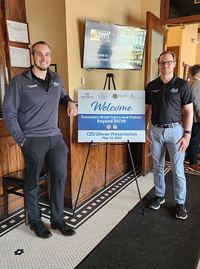 Dr. Aaron Nichols and Dr. Damien Gietzen lecturing on concussion, traumatic brain injury (TBI), and vision therapy during a professional educational event in Troy, Michigan, highlighting evidence-based neuro-optometric rehabilitation.
