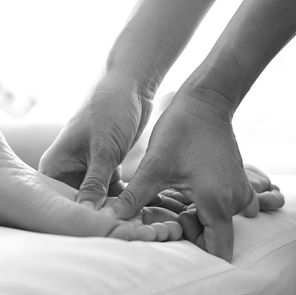 reflexology massage on bottom of feet