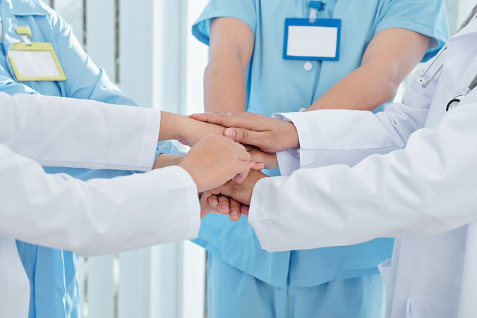 medical-worker-stacking-hands-2021-08-30-02-26-11-utc.jpeg