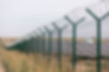 solar-panel-in-the-field-fenced-in-a-metal-barbed-2023-11-27-04-59-42-utc.jpg