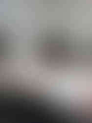 Christopher Arfani sits at his office desk, surrounded by papers and office supplies. ChristopherArfaniPT