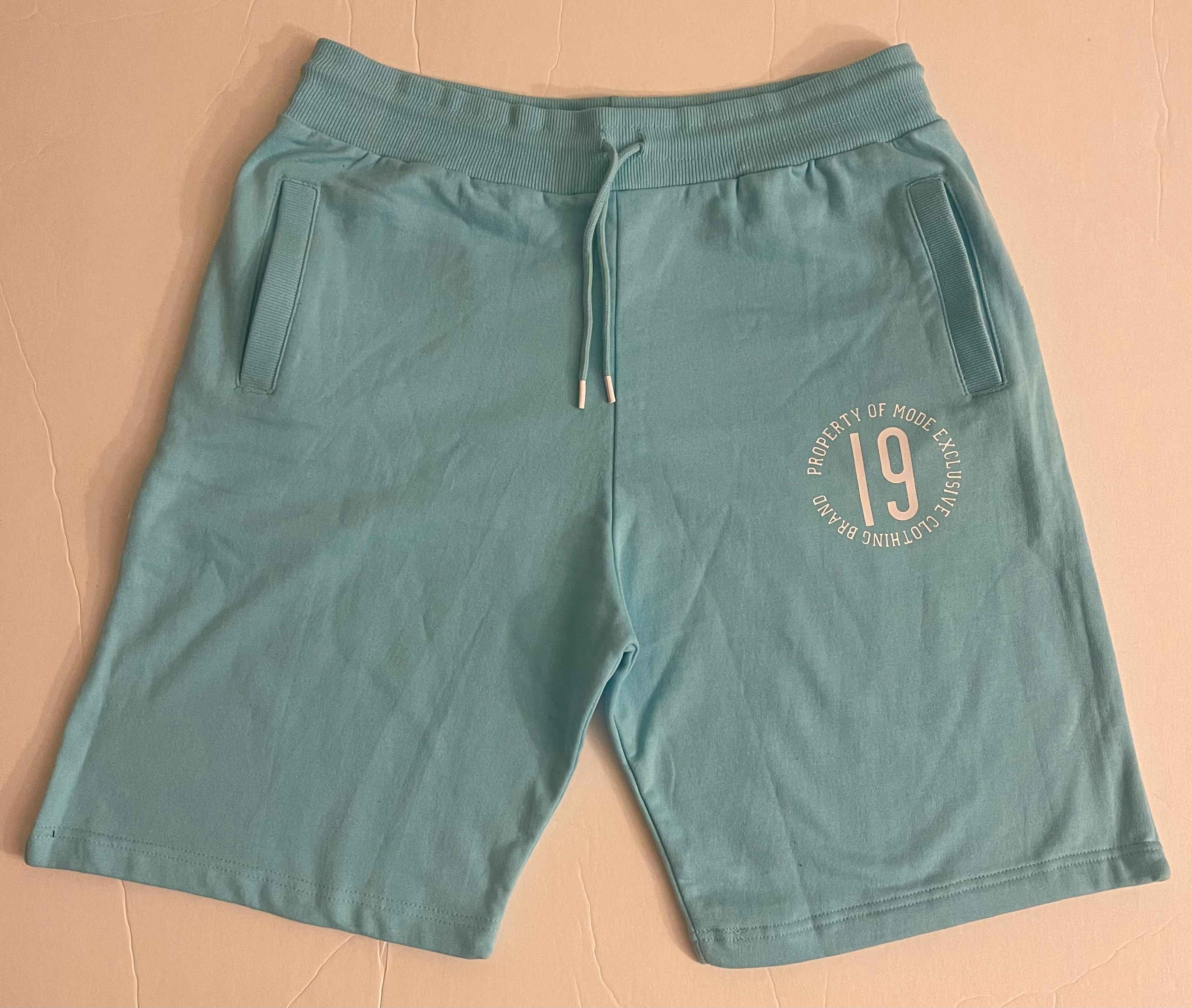 Ice blue shorts w/ white logo and white drawstring tips.