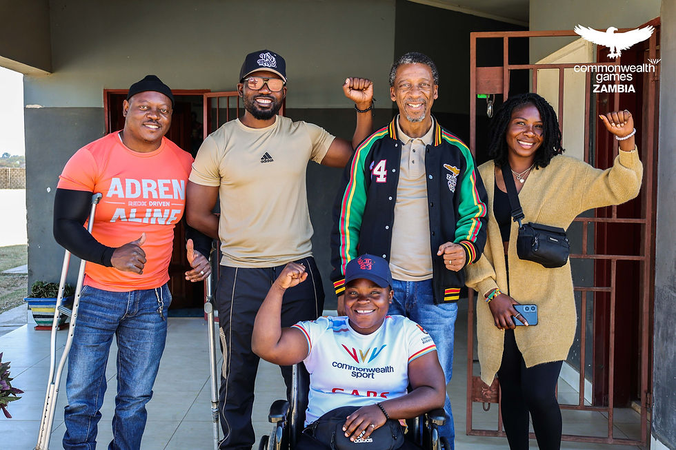 NOCZ Secretary General Boniface Kambikambi poses for a picture with para power lifter Gift Chola with other officials