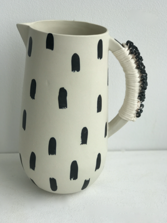 tall black/white jug