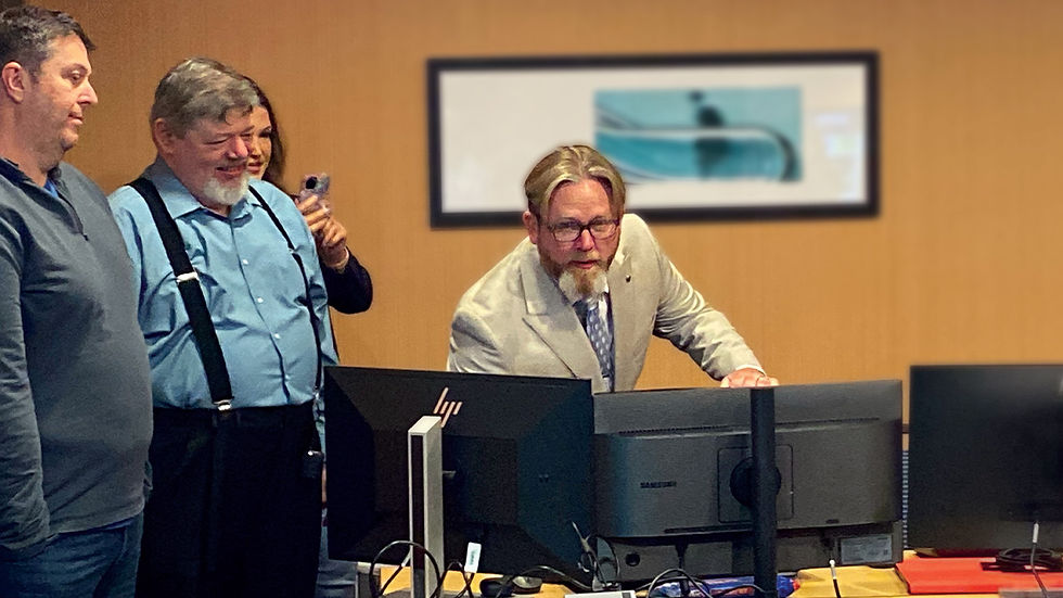 Thomas Lawler, Director of the North Dakota Lottery (center), flips the switch to the new omnichannel system on go-live day.