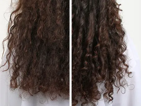 Woman properly washing her hair and scalp in the shower, illustrating healthy hair-washing technique and common shampooing mistakes.