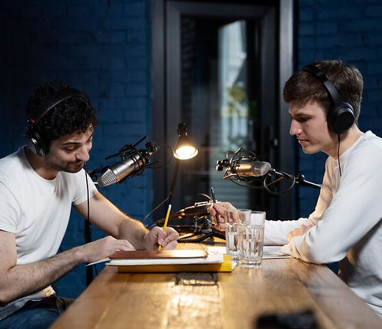 two-men-with-microphones-headphones-running-podcast_23-2149434248.jpg_ga=GA1.1.888384636.1