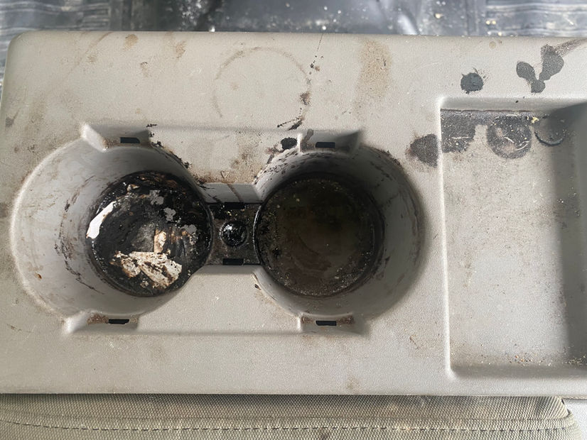 Before cleaning filthy interior cup holders