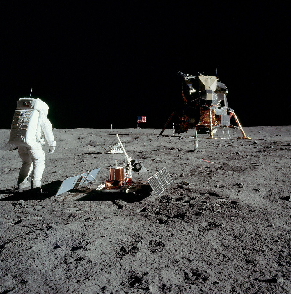 Buzz Aldrin, seismic experiment, and the lunar lander.
