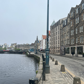 Water of Leith walkway along the river with unique shops