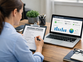 Business owner reviewing an insurance application next to a laptop representing the actual IT structure of a small business in Bergen County NJ