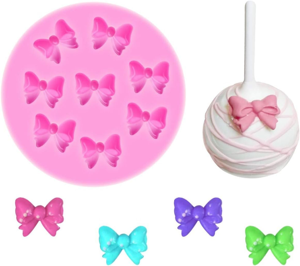 Pink silicone fondant mold with mini bow shapes used to make edible candy and fondant bows for a pink bow coquette first birthday cake.