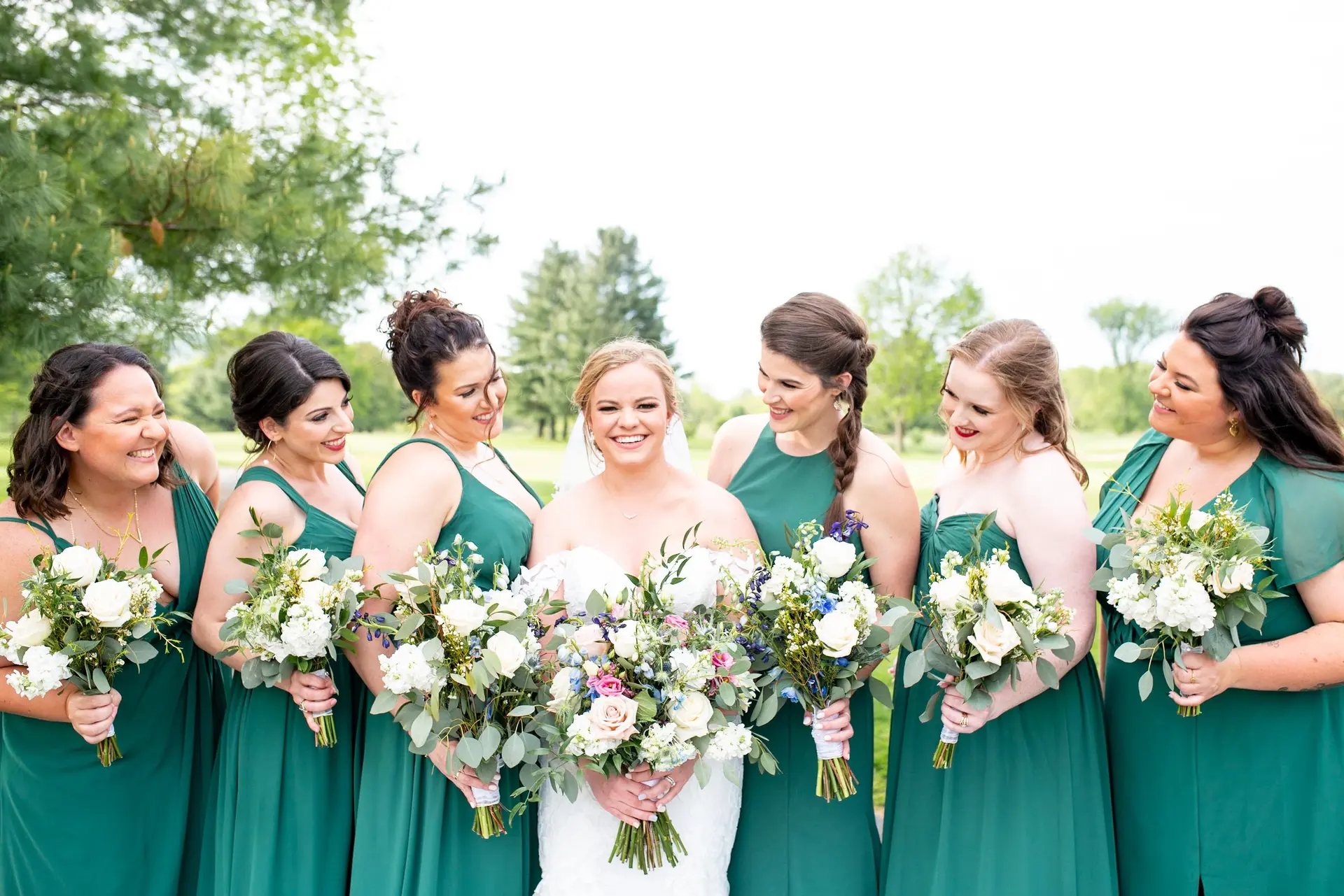Bride with bridesmaids in green dresses