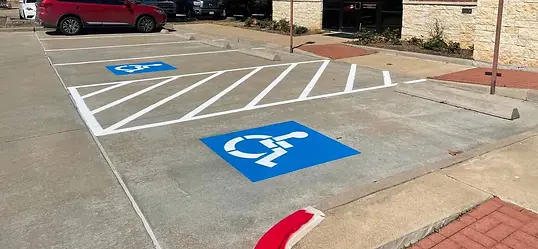 Parking lot stripes and handicap decal