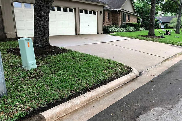 Driveway cleaning and in the very lower left hand corning you can see the darkness of the before look of the concrete