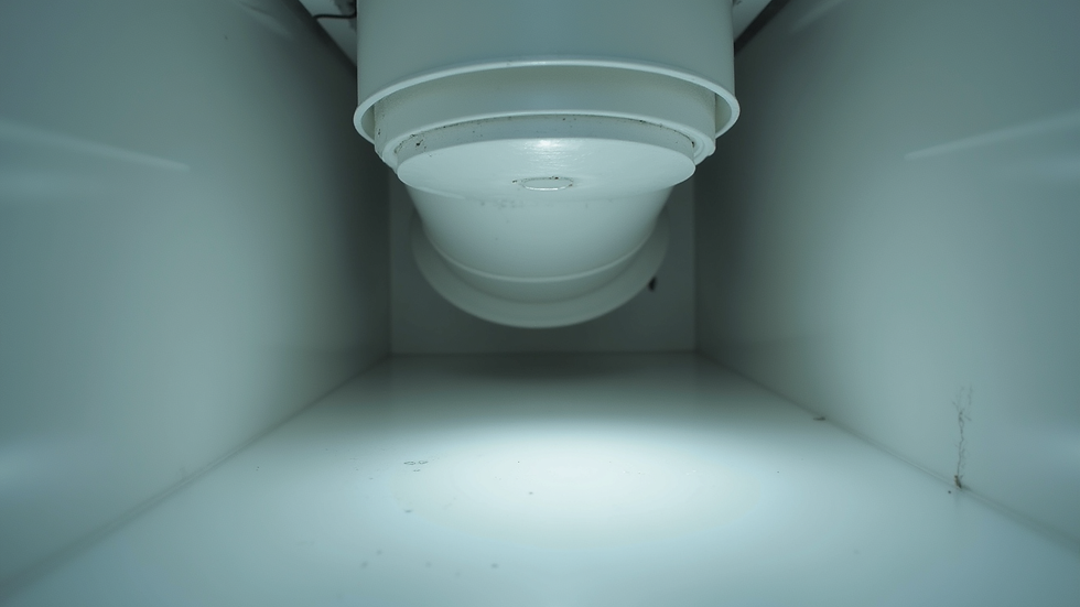 Close-up view of bathroom exhaust fan duct connection
