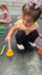 10 month old explores handbells.