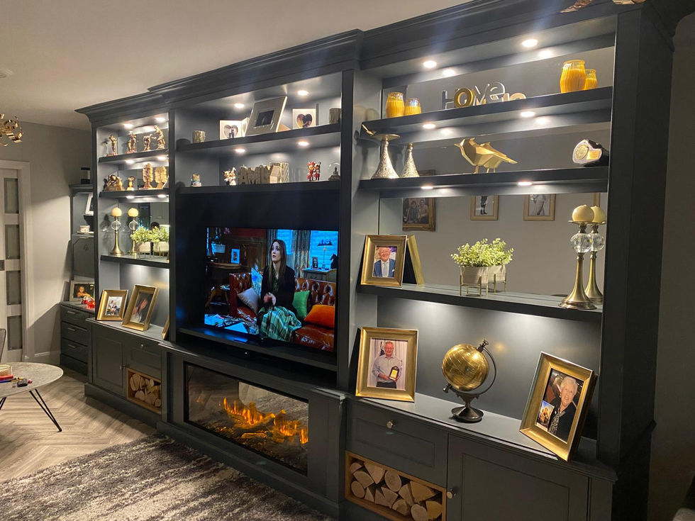Bespoke media wall by HEFF featuring a built-in fire, integrated LED lighting, and contemporary fitted furniture design in Gibraltar