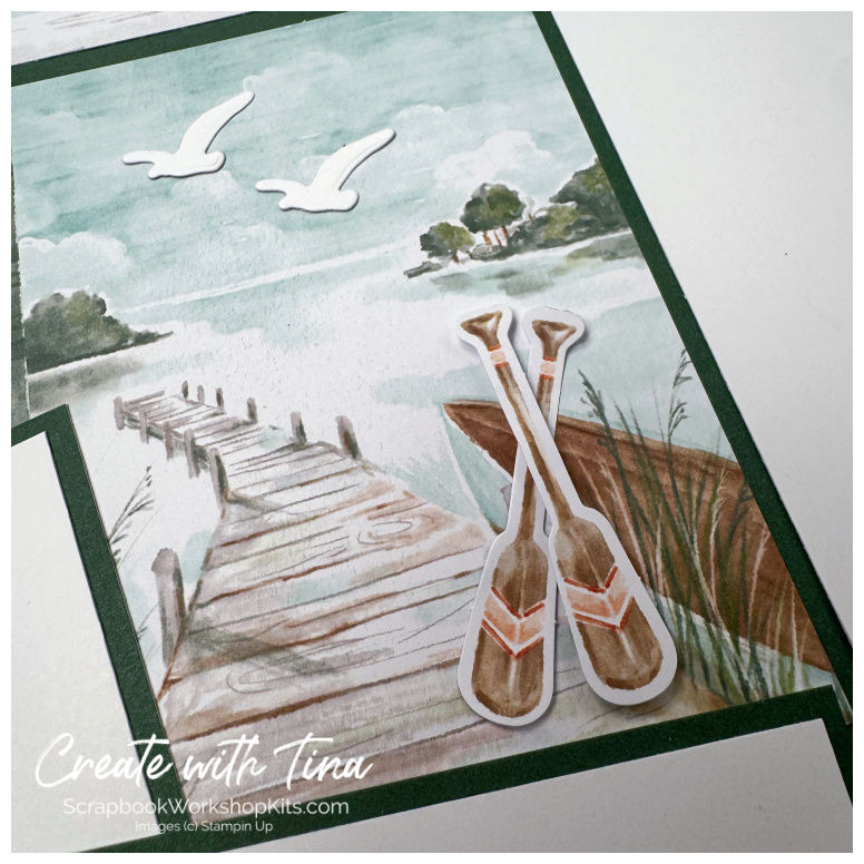 Close-up of lake dock paper and paddle embellishments from the Stampin’ Up! Lakeside Retreat scrapbook kit.