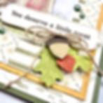 Close-up handmade Winnie the Pooh card featuring layered patterned paper, twine bow, acorn embellishment, and “You deserve a