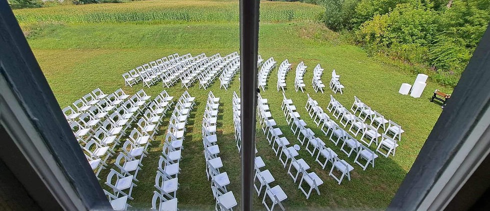 Eye-level view of rustic wooden barn interior decorated for a wedding ceremony