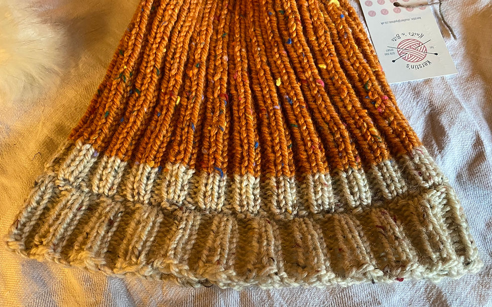 Thumbnail: Orange and beige bobble hat
