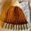 Thumbnail: Orange and beige bobble hat