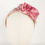Miniatura: Diadema flores lado ganchillo rosa