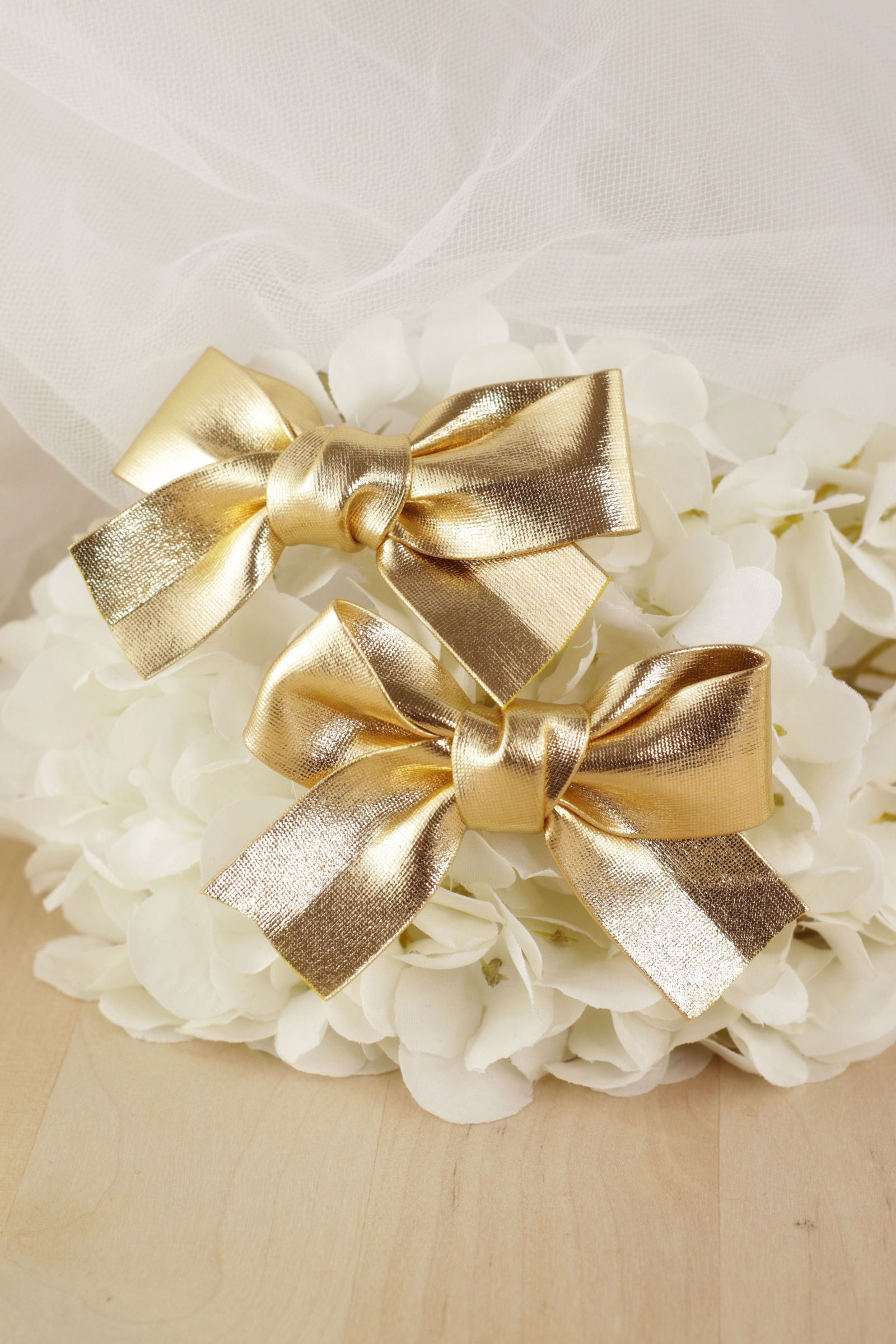 Pareja de pinzas de lazo polipiel dorado