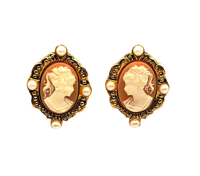 Cameo face earrings with white silhouette and brown background. Post style 