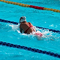 Competitive swimmer doing breaststroke