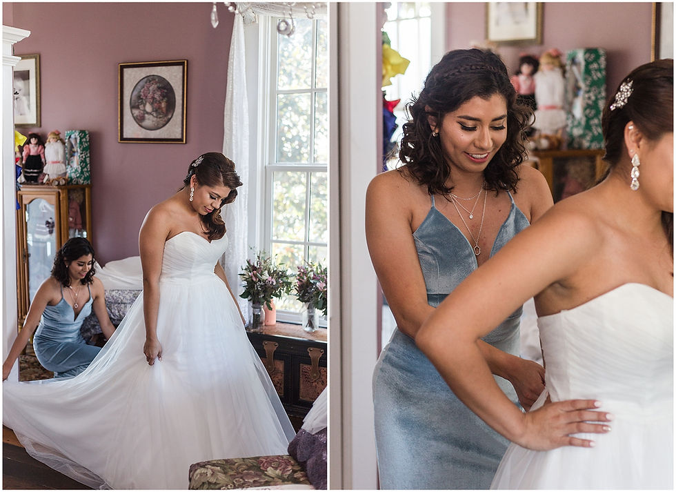 maid of honor helping bride put on dress