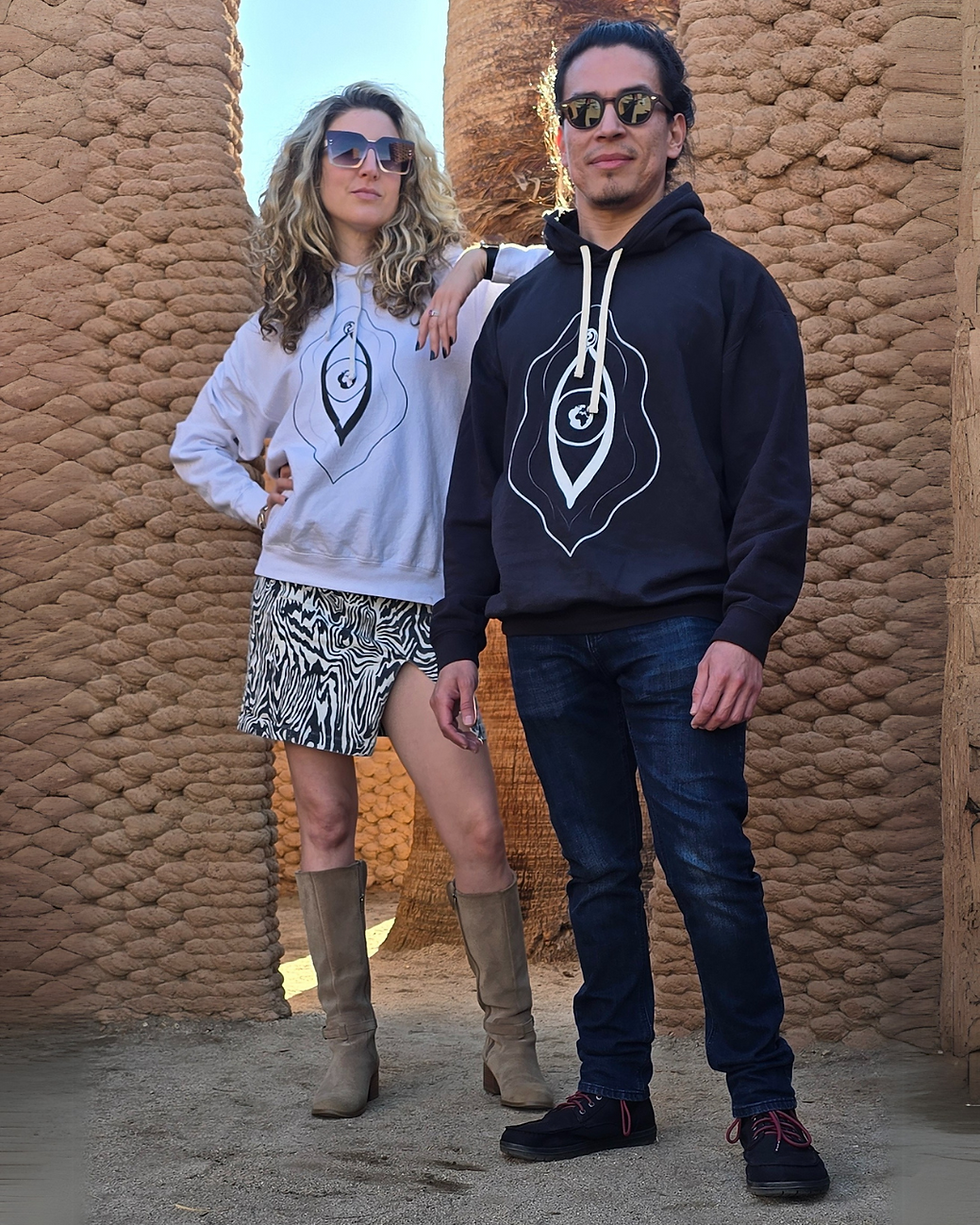 Thumbnail: A woman in a white lightweight hoodie next to a man in the black lightweight hoodie
