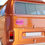 Thumbnail: Pink bumper sticker with text "Bought the car not the cult" on a van