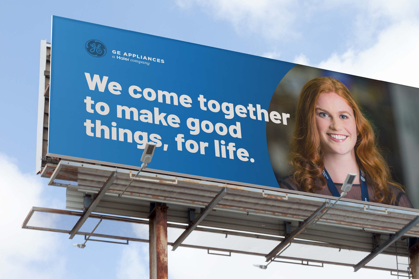 GE Appliances billboard with tagline and smiling employee
