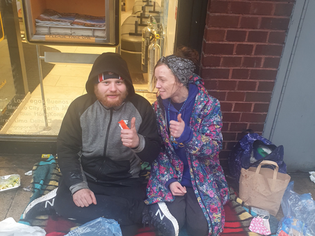 Joe with Sam on cross street in good spirit despite the cold and very happy with the hot drinks