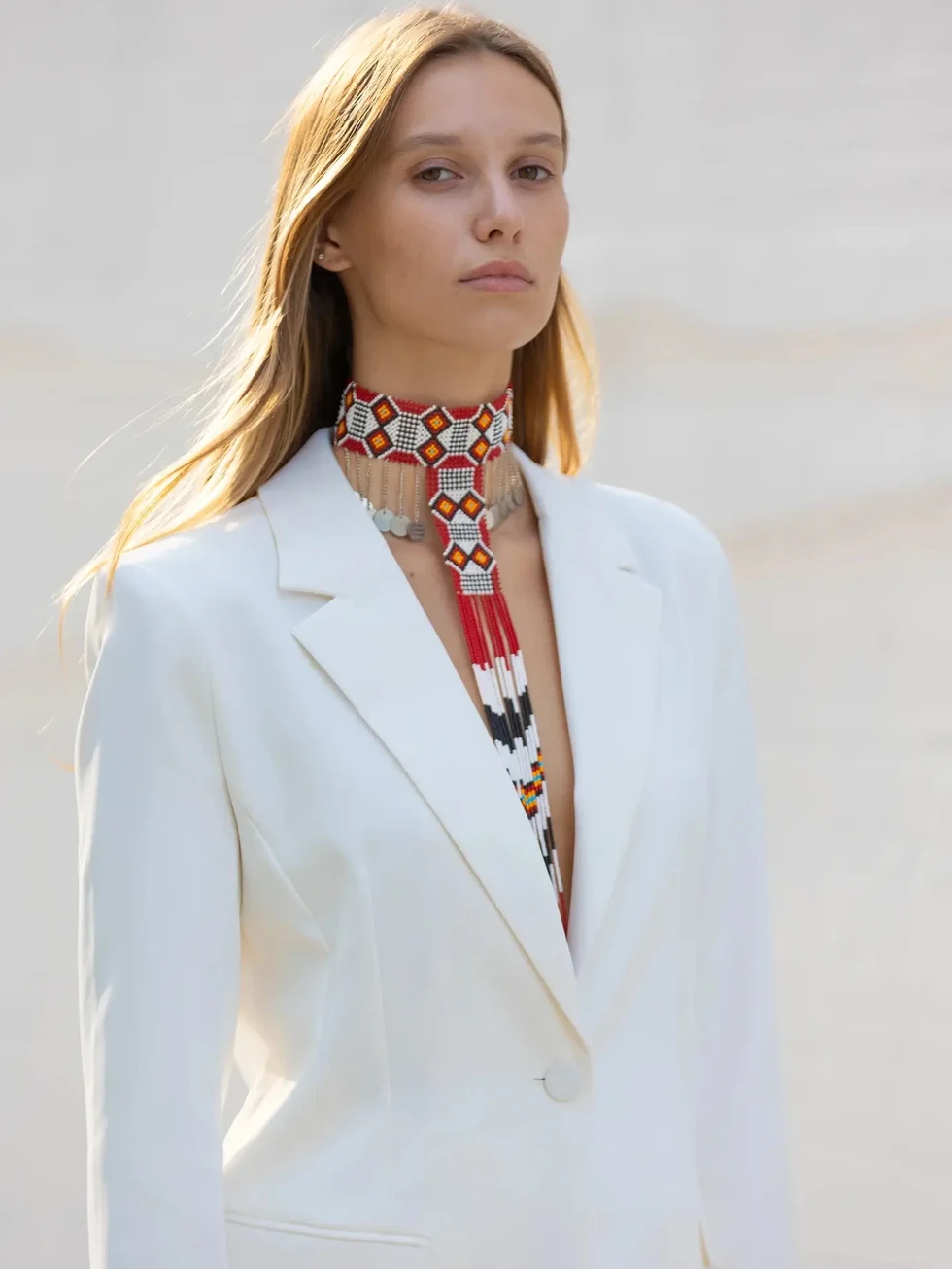 Model wearing handmade Red Wine Maasai beaded choker