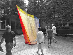 modern sculpture with rebar frame and primary color yarn stretched across the steel frame