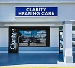 Outside view of Clarity Hearing Care Englewood office showing sign and front door in Tiffany Square Plaza