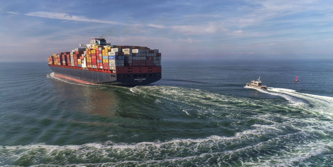 Large container ship at sea
Harbor Pilot boat next to container ship
charleston seaport
